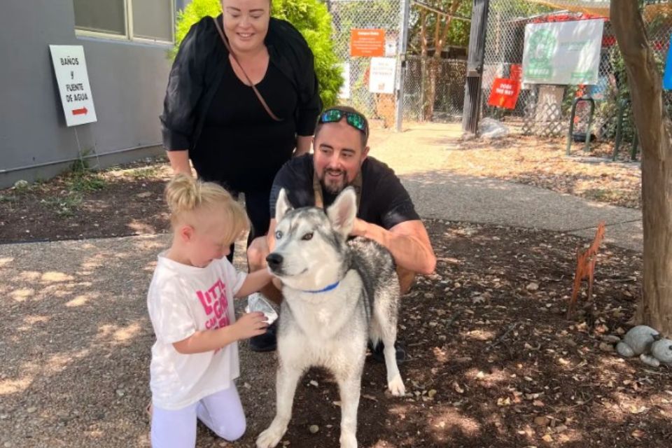 Family with husky dog