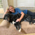 Dr. Julie McKinney Miller with her dog on her khaki Big Barker bed