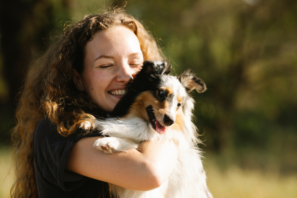 Women hugging dog