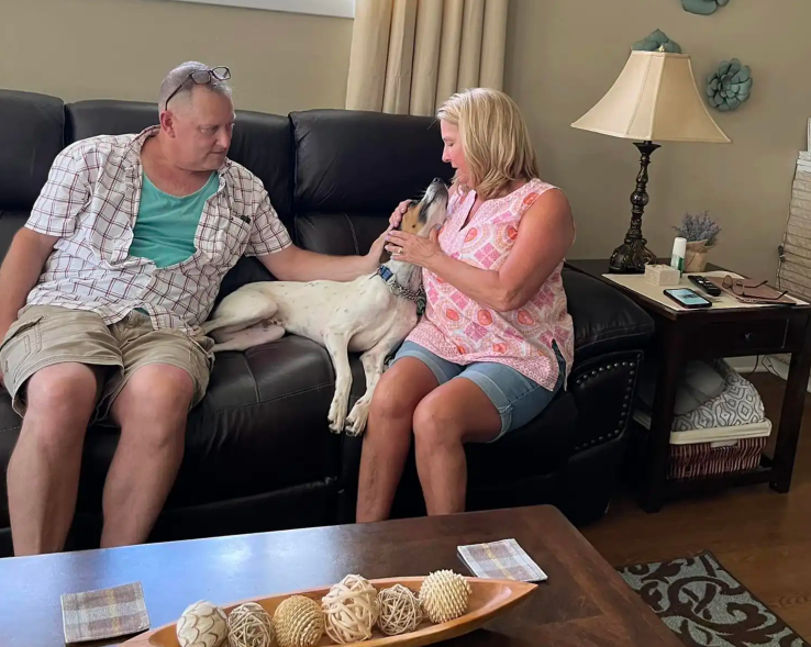 Shelter Pup Finds Joy in Loving Embrace on Adoption Day