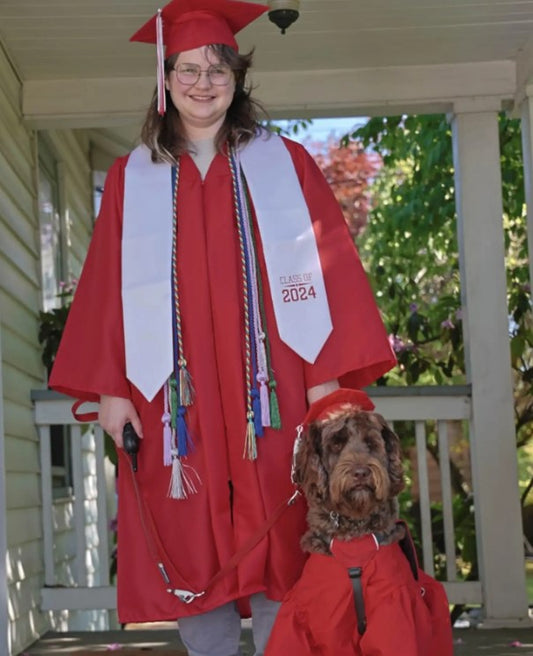 Service Dog Celebrates High School Graduation in Custom Cap and Gown